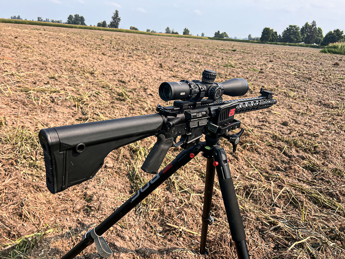 204 Ruger AR-15 Aero Precision Gen 2 lower and upper receiver with a Wilson Combat 18” Barrel and Odin Works R2 17.5-inch Handguard in a BOG Deathgrip Clamping Shooting Tripod.
